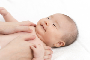 Happy baby getting an infant massage